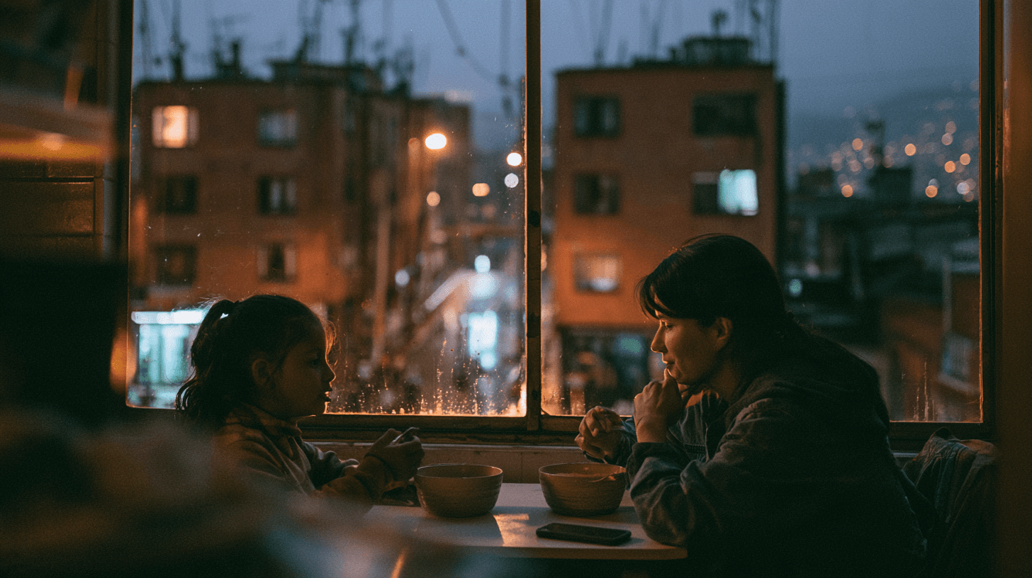 2027 · Una respuesta distinta a ya casi. Escena ficticia creada con Midjourney. Una madre y su hija cenan frente a una ventana con edificios de ladrillo en Bogotá.